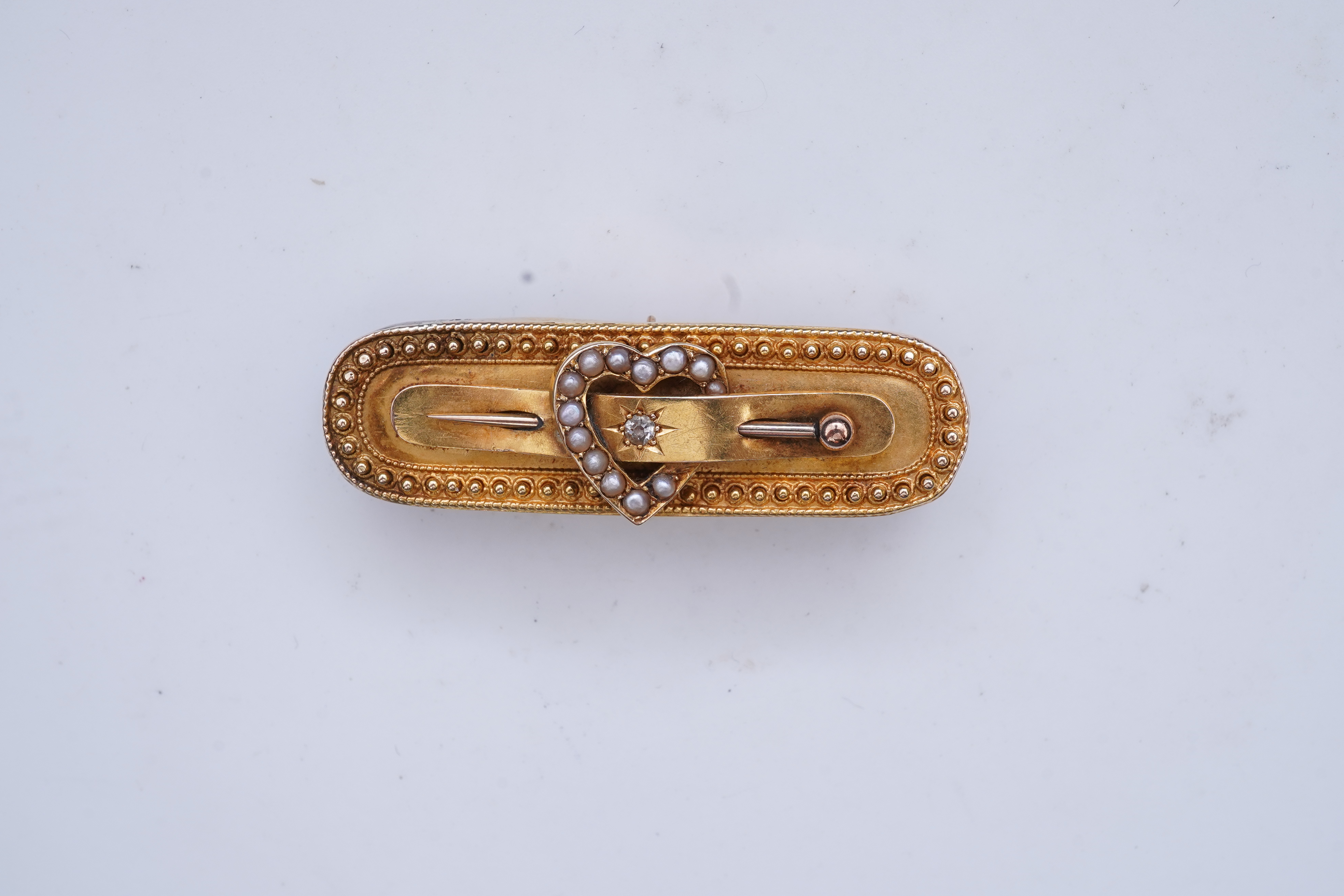 An Edwardian gold and seed pearl brooch, circa 1896